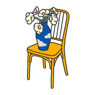 Flowers in a vase on a chair